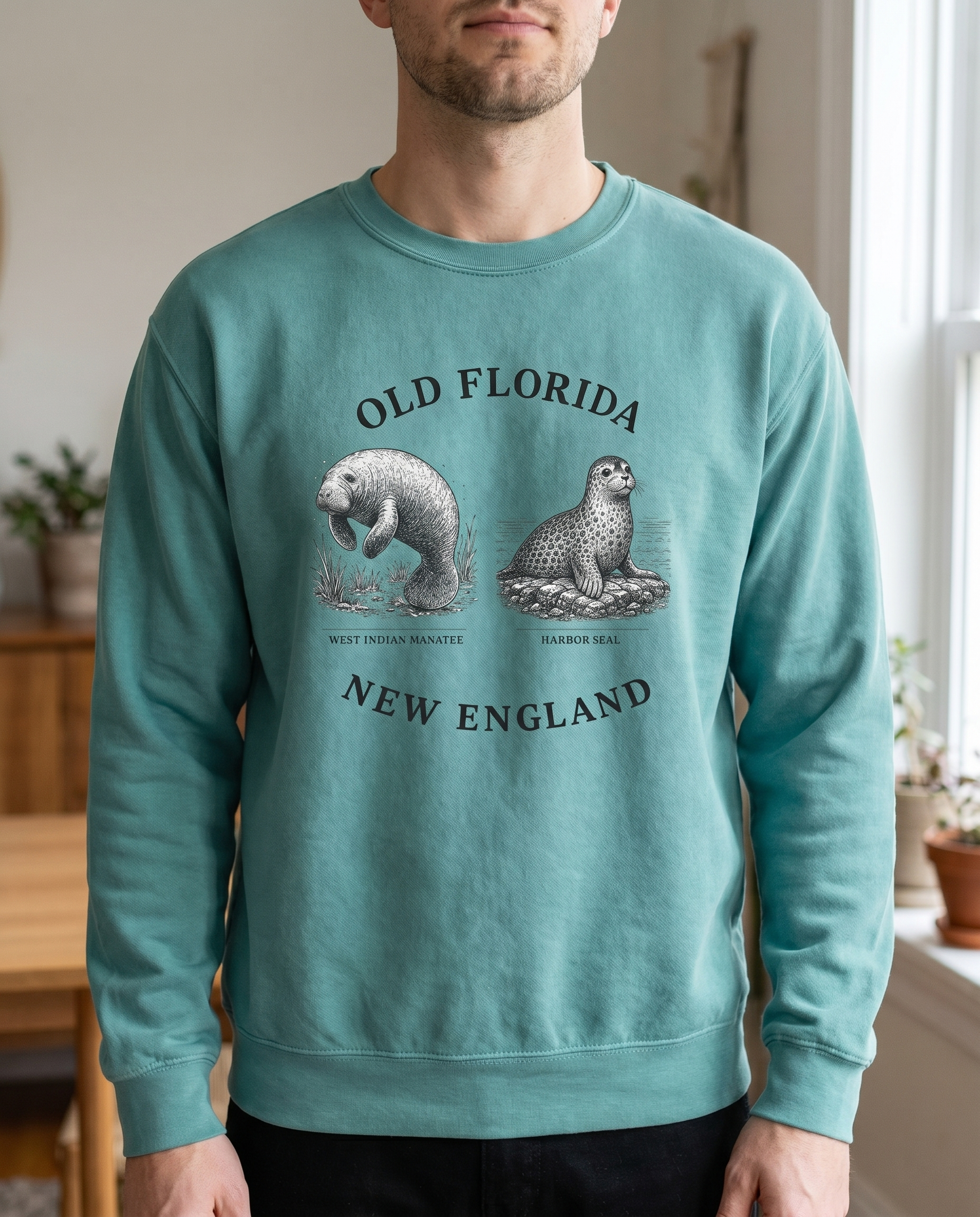Manatee and Seal Sweatshirt — chin-down close-up male, design visible